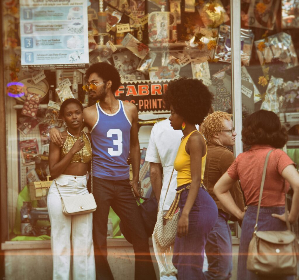 Vintage style group outside a shop in Brooklyn, capturing fashion and atmosphere of the era.
